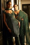 Vvani by Vani Vats_Green Georgette Embroidery Sequin Scallop V Neck Linear Saree With Blouse _at_Aza_Fashions