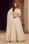 Buy_LASHKARAA_Off White Blouse And Lehenga Brocade Woven Floral V Neck Set _at_Aza_Fashions