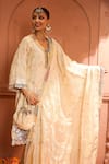 Tasuvure Indes_Ivory Tissue Silk Embroidered Thread V-neck Inayat Floral Vine Kurta Pant Set _Online_at_Aza_Fashions