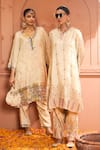 Tasuvure Indes_Ivory Tissue Silk Embroidered Thread V-neck Inayat Floral Vine Kurta Pant Set _at_Aza_Fashions