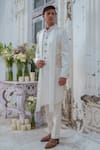 Shop_Amrit Dawani_Ivory Cape Kurta Modal Silk Hand Painted Floral Open Attached With Trouser _Online_at_Aza_Fashions