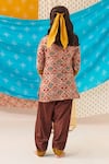 Shop_CUTE COUTURE_Brown Muslin Silk Print Folklore Kurta And Patola Pant Set _at_Aza_Fashions