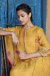 Label Kinjal Modi_Yellow Fine Chanderi And Tissue Placement Embroidered Straight Kurta Pant Set _at_Aza_Fashions