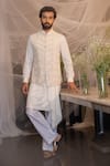 Buy Amit Arora Ivory Silk, Cotton, Modal Beads, Embroidery Hand Waistcoat With Aligarhi Set at Aza Fashions Buy_Amit Arora_Ivory Silk, Cotton, Modal Beads, Embroidery Hand Waistcoat With Aligarhi Set _at_Aza_Fashions