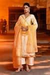 Buy_Bannhi_Yellow Dupion Embellished Gota Lace V-neck Patti Flower Kurta Pant Set _at_Aza_Fashions