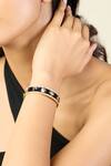 Buy_ISHARYA_Black Enamel Lucky Charms Cuff Bracelet _at_Aza_Fashions