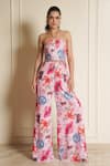 Buy_Vesture_Pink Georgette Print Floral Halter Neck Petal Pizza Jumpsuit _at_Aza_Fashions