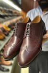 Buy_FELLMONGER_Burgundy Longwing Brogue Pattern Derby Shoes _at_Aza_Fashions