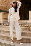 Buy_Dash and Dot_Ivory 100% Polyester Embellished Chain Shawl Textured Tie-up Top And Pant Set _at_Aza_Fashions