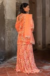 Shop_SSHILPA SAMRIYA_Orange Kurta Crepe Hand Embroidered Floral Leaf Printed Skirt Set_at_Aza_Fashions