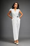 Deepika Arora_White Ponte Roma Embellished Leather Sphere Short Sleeves Belted Jumpsuit _at_Aza_Fashions