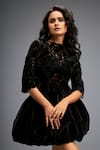 Deepika Arora_Black Vegan Leather Cutwork Geometric Floral Pattern Top With Balloon Skirt _at_Aza_Fashions