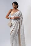 ADISEE_Ivory Ajrakh Handwoven Textured Wrist Bag _Online_at_Aza_Fashions