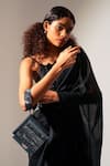 Buy_ADISEE_Black Ajrakh Textured Handwoven Wrist Bag _at_Aza_Fashions