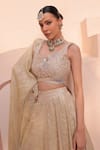 Shop_Label Astha Chhabra_Gold Banarsi Hand Embellished Sequin Asymmetric Floral Lehenga Blouse Set _Online_at_Aza_Fashions