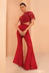 Shop_Label Astha Chhabra_Red Organza Hand Embellished Floral Asymmetric Top With Bellbottom Pant _at_Aza_Fashions