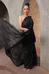 Buy_Label Astha Chhabra_Black Organza Hand Embroidered Cutdana Asymmetric Pleat Gown With Trail _at_Aza_Fashions