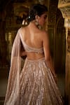 Buy_Seema Gujral_Rose Gold Net Embellished Sequins Asymmetric Neck Lehenga With Blouse _Online_at_Aza_Fashions