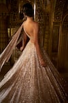 Shop_Seema Gujral_Rose Gold Net Embellished Sequins Asymmetric Neck Lehenga With Blouse _Online_at_Aza_Fashions