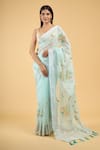 Buy_Samyukta Singhania_Blue Linen Blend Hand Painted Floral Tassel Bordered Saree With Running Blouse 