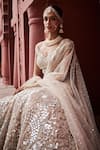 Reynu Taandon_Ivory Chanderi Embroidered Sequin Plunging Elegant Lehenga Set _at_Aza_Fashions