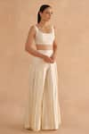 Ruchi Marodia_White Chiniya Silk Plain Scoop Neck Sleeveless Blouse And Pleated Pant Set _at_Aza_Fashions