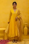 Buy_MITHI SUPARI_Yellow Pure Silk Chnaderi Embroidered Thread V Neck Rajni Anarkali Set _at_Aza_Fashions