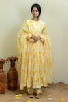 Buy_MITHI SUPARI_Yellow Cambric Cotton Printed Floral Round Anarkali Set _at_Aza_Fashions