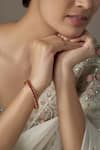 Buy Karisa Designs Red Stones Kundan Embellished Bangle at Aza Fashions Buy_Karisa Designs_Red Stones Kundan Embellished Bangle _at_Aza_Fashions