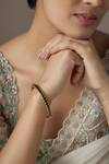 Buy Karisa Designs Green Stones Quad Kundan Embellished Bangle at Aza Fashions Buy_Karisa Designs_Green Stones Quad Kundan Embellished Bangle _at_Aza_Fashions