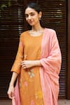 Shop_Vaayu_Orange Muslin Cotton Embroidered Floral Applique Round Kurta Pant Set _Online_at_Aza_Fashions