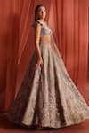 Buy_Adaara Couture_Silver Net Embroidery Jaal Asymmetric Flair Bloom Lehenga Set _Online_at_Aza_Fashions