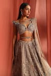 Shop_Adaara Couture_Silver Net Embroidery Jaal Asymmetric Flair Bloom Lehenga Set _Online_at_Aza_Fashions