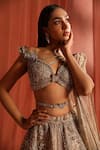 Adaara Couture_Silver Net Embroidery Jaal Asymmetric Flair Bloom Lehenga Set _at_Aza_Fashions