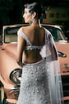 Shop_Seema Gujral_Ivory Net Embellished Sequin Plunge Sweetheart Bridal Mermaid Lehenga Set _at_Aza_Fashions