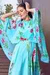 Shop_Mandira Wirk_Blue Chiffon Print Botanic Bloom Ruffled High Neck Cape Sleeves Maxi Dress _Online_at_Aza_Fashions