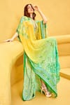 Shop_Mandira Wirk_Yellow Crepe Printed Floral Texture Plunge V Neck Ombre Placement Kaftan _Online_at_Aza_Fashions