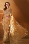 Buy_Seema Gujral_Gold Net Embroidered Sequins Plunged Sweetheart Floral Saree With Blouse _at_Aza_Fashions