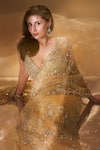 Seema Gujral_Gold Net Embroidered Sequins Plunged Sweetheart Floral Saree With Blouse _at_Aza_Fashions