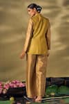 Shop_17:17 by Simmi Saboo_Gold Raw Silk Embellished Sequin Notched Lapel Texture Printed Blazer With Pant _at_Aza_Fashions