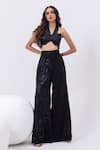 Buy_MEHAK SHARMA_Black Satin Embroidered Cutdana Halted Neck Swirl Flared Pant With Blouse _at_Aza_Fashions