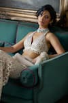 Shop_Seema Gujral_Cream Net Embroidered Crystal Halter Floral Cutwork Blouse Boot-cut Pant Set _Online_at_Aza_Fashions