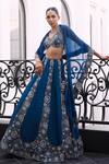 Charu and Vasundhara_Blue Tafetta Tussar Viscose Organza Embroidered Sequin Farah Lehenga Set _at_Aza_Fashions