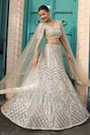 Tasuvure Indes_Ivory Net Embroidered Bead Round Lehenga Set _at_Aza_Fashions