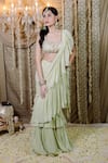 Buy_Foram Patel_Green Georgette Pre-draped Ruffle Saree With Cowrie Bloom Embellished Blouse _at_Aza_Fashions