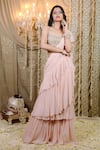 Buy_Foram Patel_Peach Solid Pre-draped Tiered Ruffle Saree With Cowrie Embellished Blouse _at_Aza_Fashions