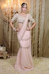 Buy_Foram Patel_Peach Cowrie Shell Border Embellished Pre-draped Mumtaz Saree With Blouse _at_Aza_Fashions