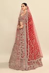 Kalighata_Red Raw Silk Embroidered Cutdana Leaf Elnaz Ethnic Motif Bridal Lehenga Set _at_Aza_Fashions