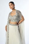 Buy_Rishi and Soujit_Ivory Bustier And Skirt Georgette Hand Embroidery Cutdana Pleated Lehenga Set _Online_at_Aza_Fashions