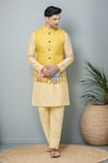 Buy_Arihant Rai Sinha_Yellow Kurta And Churidar Silk Printed Cow Threadwork Bundi Set _at_Aza_Fashions